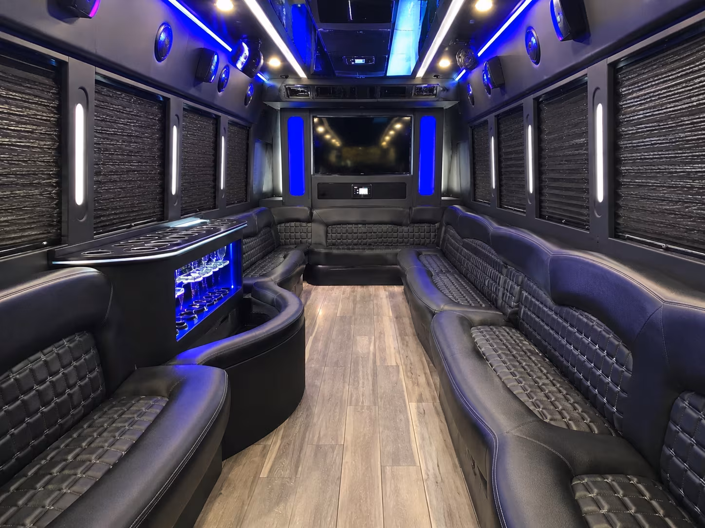 Wedding guests seated inside a party bus serving Brownsville